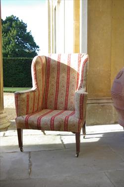 19th century Howard and Sons wing chair.jpg